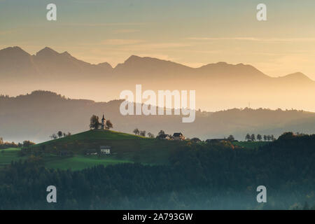 Autumn landscape of a beautiful church on the top of a hill, in Slovenia Stock Photo