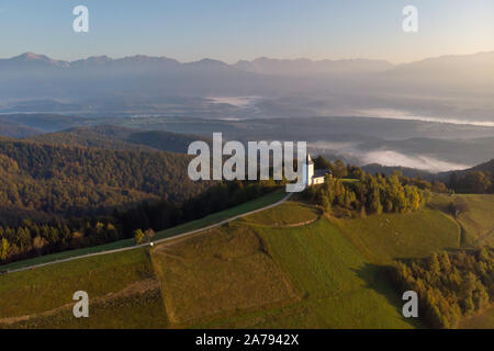 Autumn landscape of a beautiful church on the top of a hill, in Slovenia Stock Photo