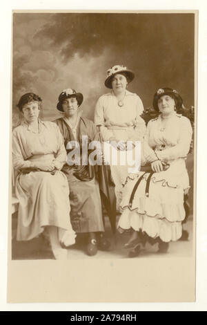 Early 1900's world war one era postcard of four lady friends wearing hats, dated July 1915 on the reverse, U.K.