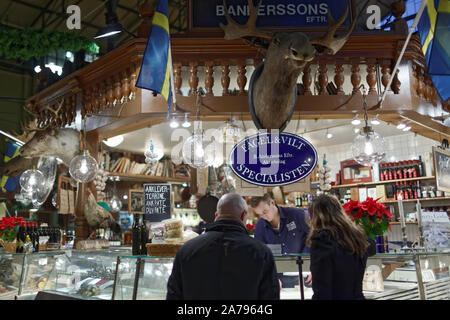 People in Ostermalm Market Hall in Stockholm, Sweden Stock Photo