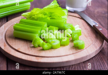 fresh juicy celery, celery stalks close up on wooden background Stock Photo