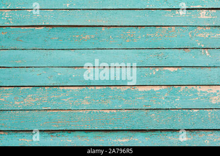 wooden background, a fragment of the wall of an old wooden house painted in turquoise Stock Photo