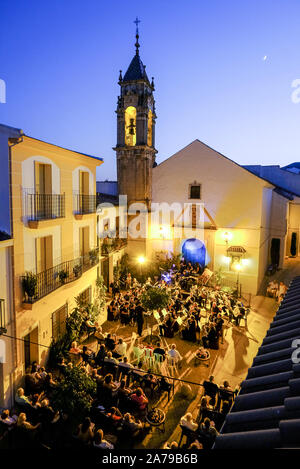 Summer evening outdoor public concert of popular music by the town band in front of Plaza San Marcos in Carcabuey, Cordoba Province, Andalucia, Spain Stock Photo