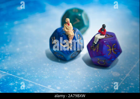 miniature figurines and esoteric dice, fortune telling concept Stock Photo