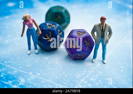 miniature figurines and esoteric dice, fortune telling concept Stock Photo