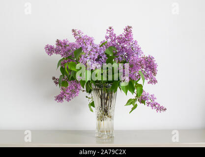 Home interior decor, bouquet of lilacs in a vase Stock Photo