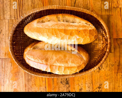 Vietnamese style bread (Baguette) in basket at local restaurant. Stock Photo