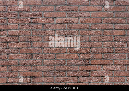 OLd wall from many small red bricks as background closeup front view horizontal Stock Photo
