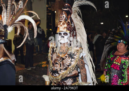 Los Angeles, California/USA - October 30, 2019: A man dressed in traditional Indigenous attire participates in the Dia de los Muertos celebration at O Stock Photo