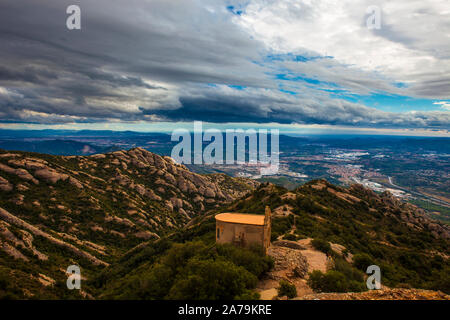 Ermita de Sant Joan, Montserrat, Catalonia, built in the 19th Century next the Ermita de Sant Onofre, which is built into the cliff above in the Tebes Stock Photo
