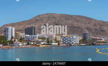 Los Cristianos, Tenerife, Canary Islands, Spain - September 15, 2019: scenic views towards Los Cristianos popular resort and harbor with many tourists Stock Photo
