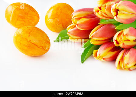 Tulips and yellow Easter eggs Stock Photo