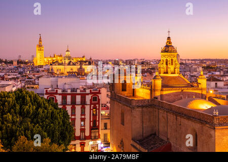 Sunset Seville skyline view of Seville cathedral La Giralda bell tower Anunciation Church and city rooftops Seville Spain Seville Andalusia Spain EU Stock Photo