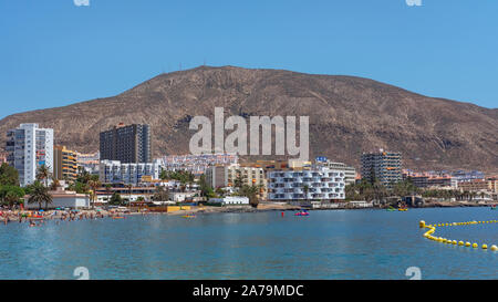 Los Cristianos, Tenerife, Canary Islands, Spain - September 15, 2019: scenic views towards Los Cristianos popular resort and harbor with many tourists Stock Photo