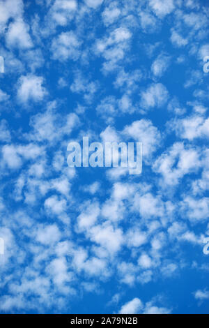 Blue sky with lots small white clouds - spotted texture Stock Photo