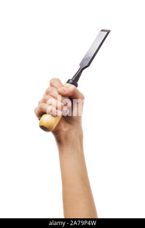 Chisel in the hands of a carpenter. Girl holds a construction tool Isolated on a white background Stock Photo