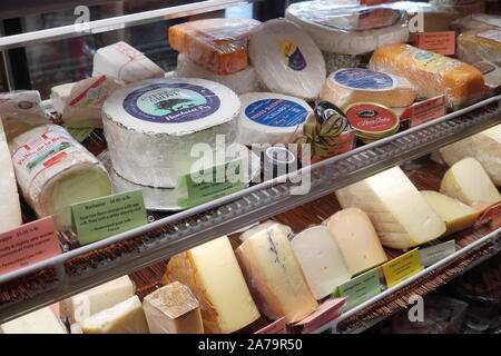 Boothbay Harbor, ME / USA - October 20, 2019: Various gourmet cheeses behind a glass display at Eventide Specialties Stock Photo