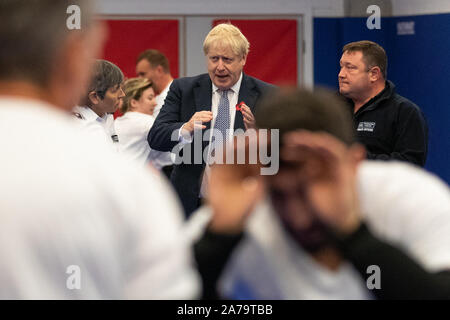 Prime Minister Boris Johnson observes a self defence class during a visit to Metropolitan Police training college in Hendon, north London. Stock Photo