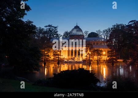 Night view of Crystal Palace or Palacio de cristal in Retiro Park in  Madrid
