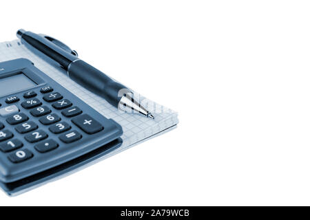 Automatic pen, calculator, notebook on a white background close-up. Stock Photo