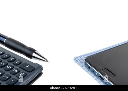 Automatic pen, calculator, notebook, phone on a white background close-up. Stock Photo