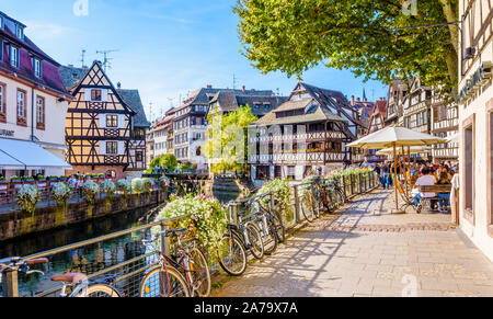 Late afternoon sunshine on the Benjamin Zix square in the Petite France quarter in Strasbourg, France, along the canal lined with half-timbered houses