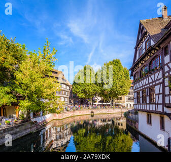 The Benjamin Zix square in the Petite France quarter in Strasbourg, France, is popular for its half-timbered houses and sidewalk cafe on the canal. Stock Photo
