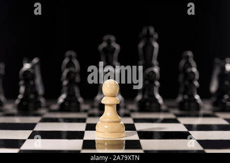 Single pawn against many enemies as a symbol of difficult unequal fight or struggle of minorities