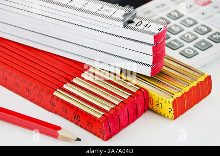 Various folding rules on white background Stock Photo