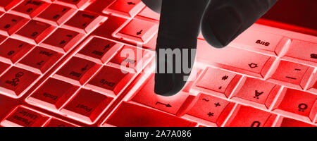 Keyboard with hand and red light Stock Photo