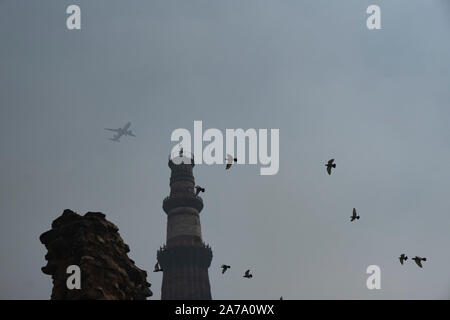 View of Qutub Minar againt the screen arches. Stock Photo