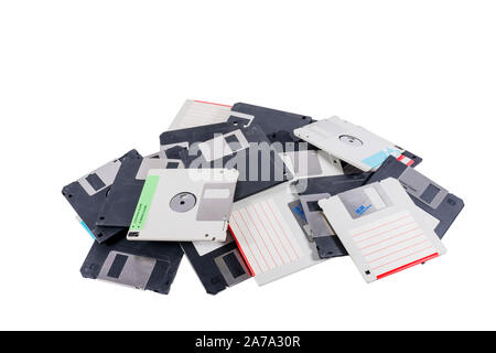 Old computer diskettes in a heap isolated on white background Stock Photo