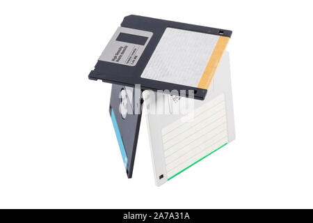 Old computer diskettes in a construction isolated on white background Stock Photo
