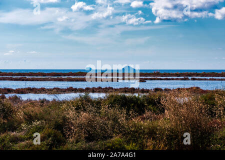 Wild South West Sardinia in the distance the Toro and Vacca islands. View from the Porto Botte pond. Stock Photo