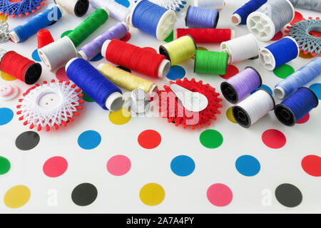 Sewing kit and sewing thread as one background Stock Photo