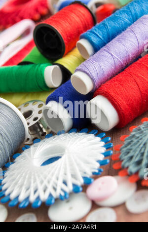 Sewing kit and sewing thread as one background Stock Photo