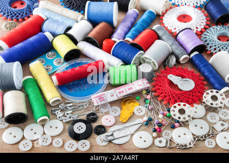 Sewing kit and sewing thread as one background Stock Photo