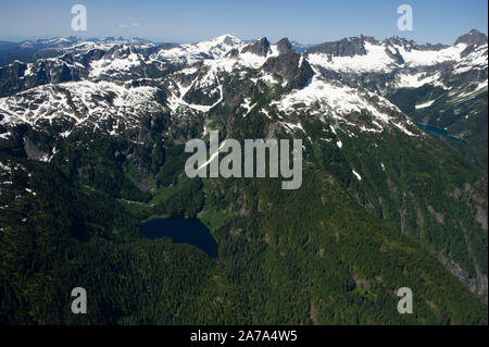 Aerial views of the alpine and sub-alpine mountains and lake along the Howe Sound between Whistler and Squamish in British Columbia, Canada. Stock Photo