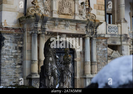 Statues outside Peleș Castle in Sinaia, Romania on a snowy day. Stock Photo