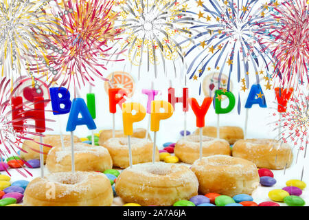 Happy Birthday with donuts firework and candles Stock Photo