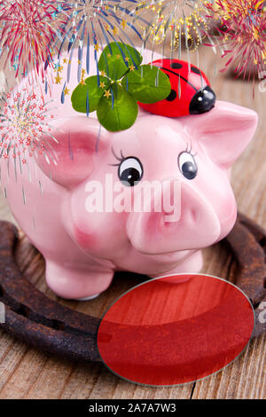 Lucky concept with piggy bank and horseshoe Stock Photo