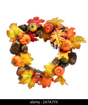 Autumn wreath with artificial pumpkins, acorns, fir cones and berries over white background. Happy Thanksgiving and Halloween design. Copy space. Stock Photo