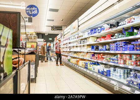 Customers shopping inside a Lidl supermarket. Stock Photo