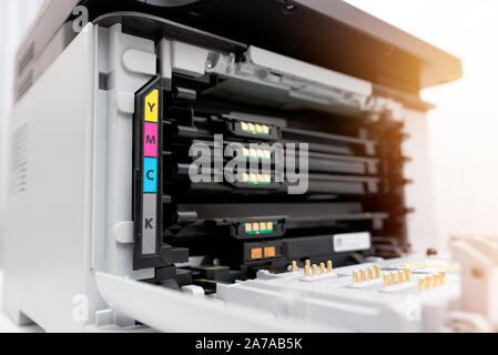 Toners in the laser printer. Multifunction printer, scanner, copier device. Stock Photo
