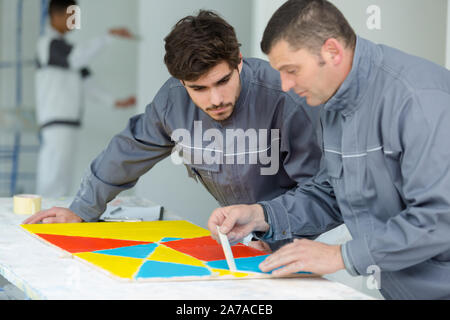 professional interior renovation crew at work in house Stock Photo