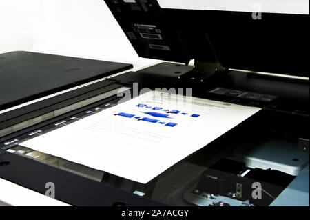 Copier with sheet of paper in close up view Stock Photo