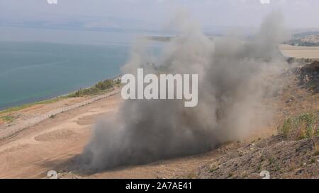 Enginers of 4M defense with protective gear inspecting an old Syrian minefield just before clearing the mines on Gofra beach in the sea of Galilee, Israel Stock Photo