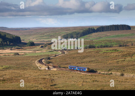 Abellio Scotrail class 156 sprinter train winding across the moors at  Drumahastie, Ayrshire, Scotland on the railway line to Stranraer Stock Photo