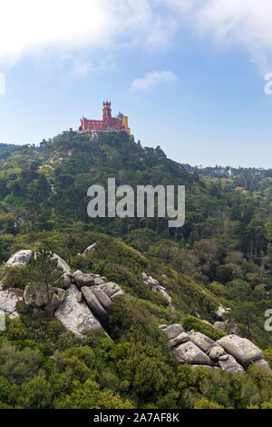 Scenic view of the Pena Palace (Palacio da Pena) on top of a hill and lush landscape in Sintra, Portugal. Stock Photo