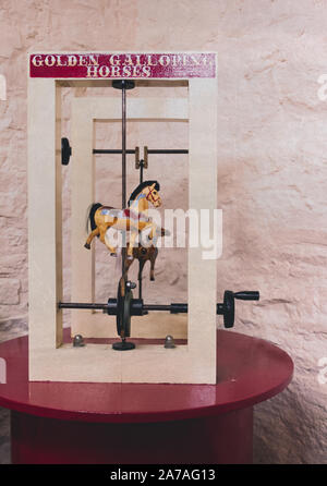 Childrens learning toy showing them how fairground carousel horses work. Stock Photo